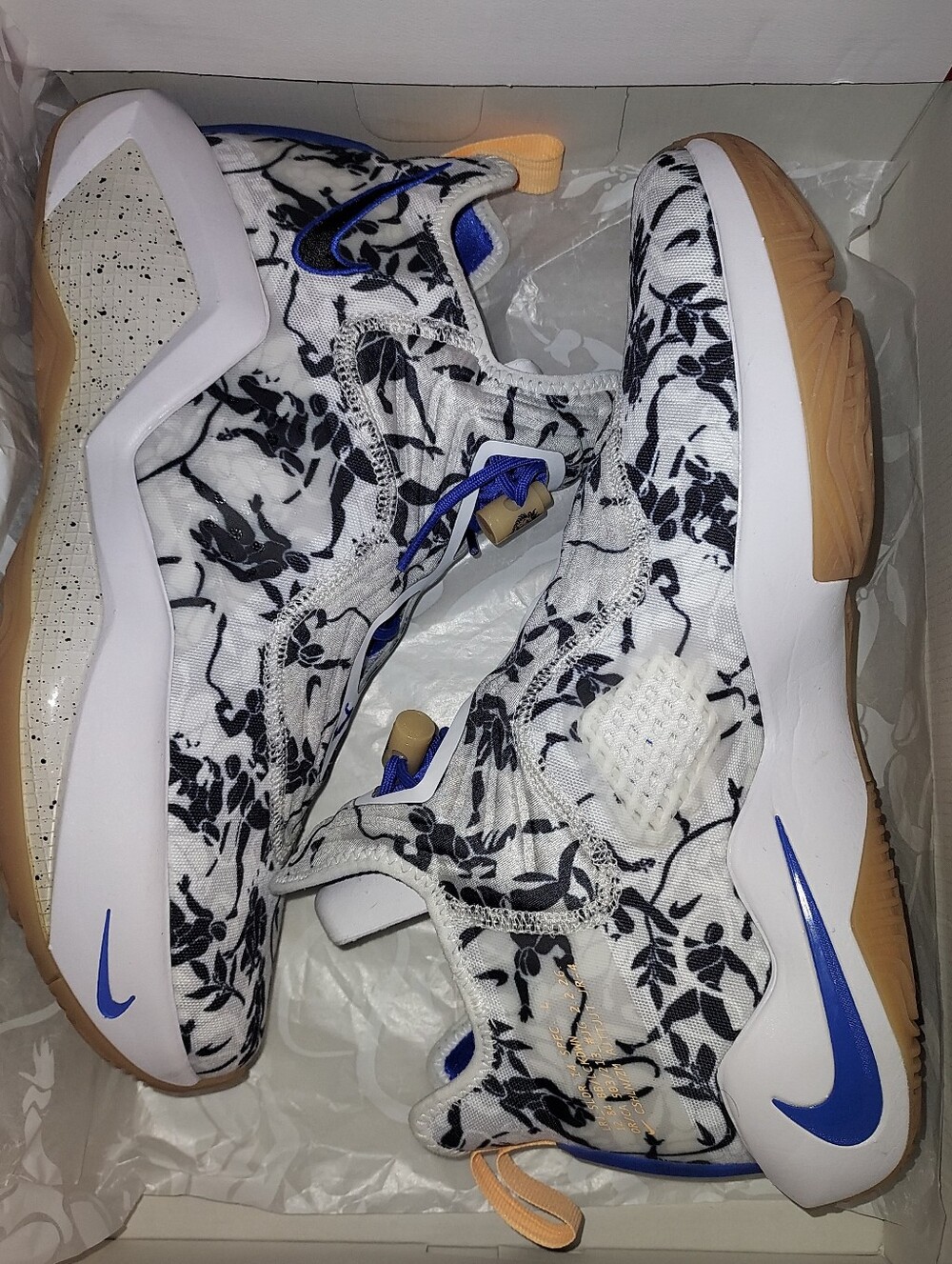 Nike Men’s White Floral Training Shoes with Black Print and Blue Details